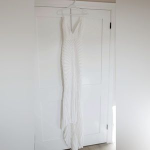 Long sequin form fitting white dress with low back